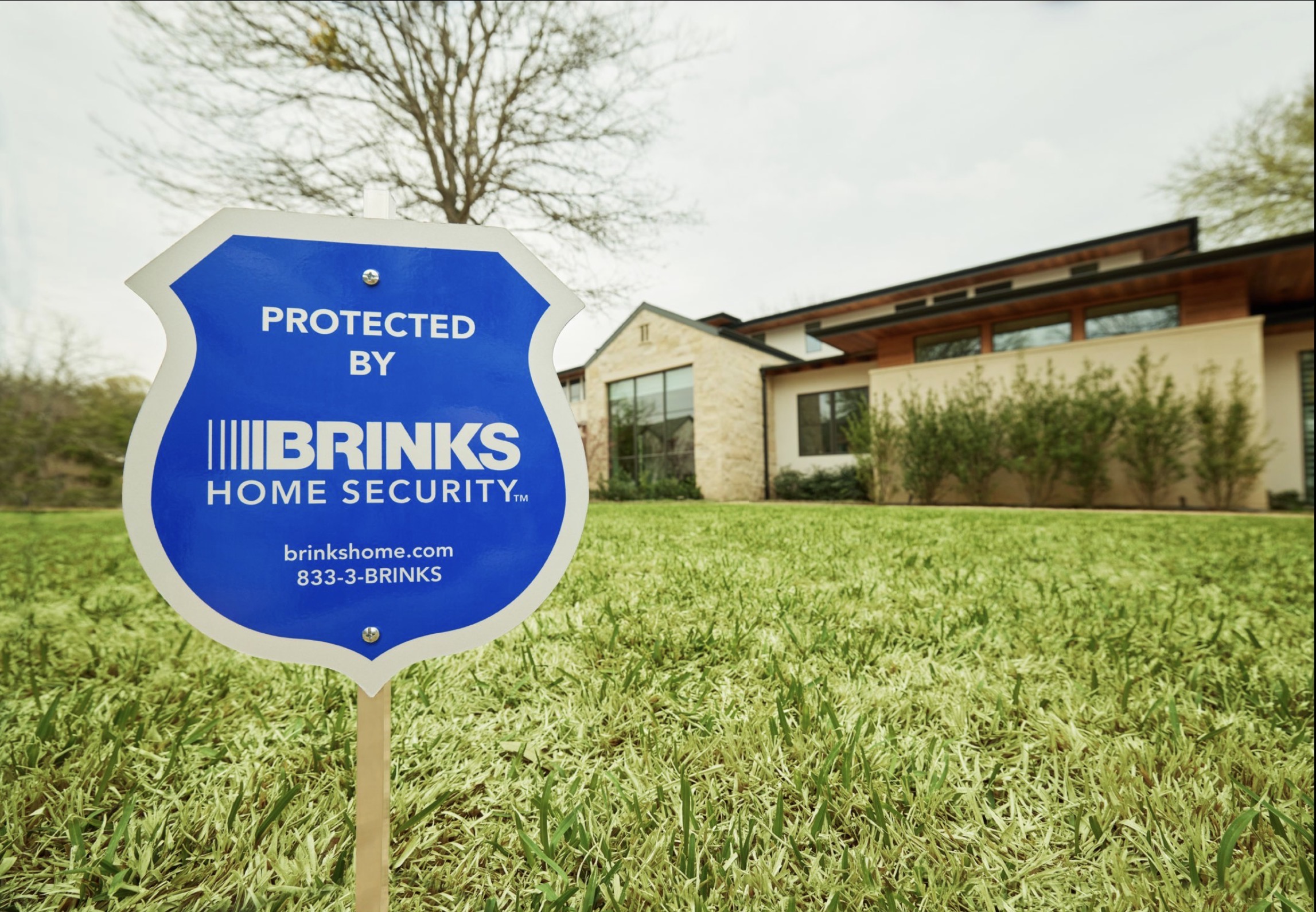 Brinks Home security sign outside a modern home